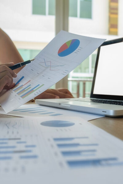 Asia business people discussing the charts and graphs showing the results of their successful teamwork.Vintage tone Retro filter effect,soft focus,low light.(selective focus)